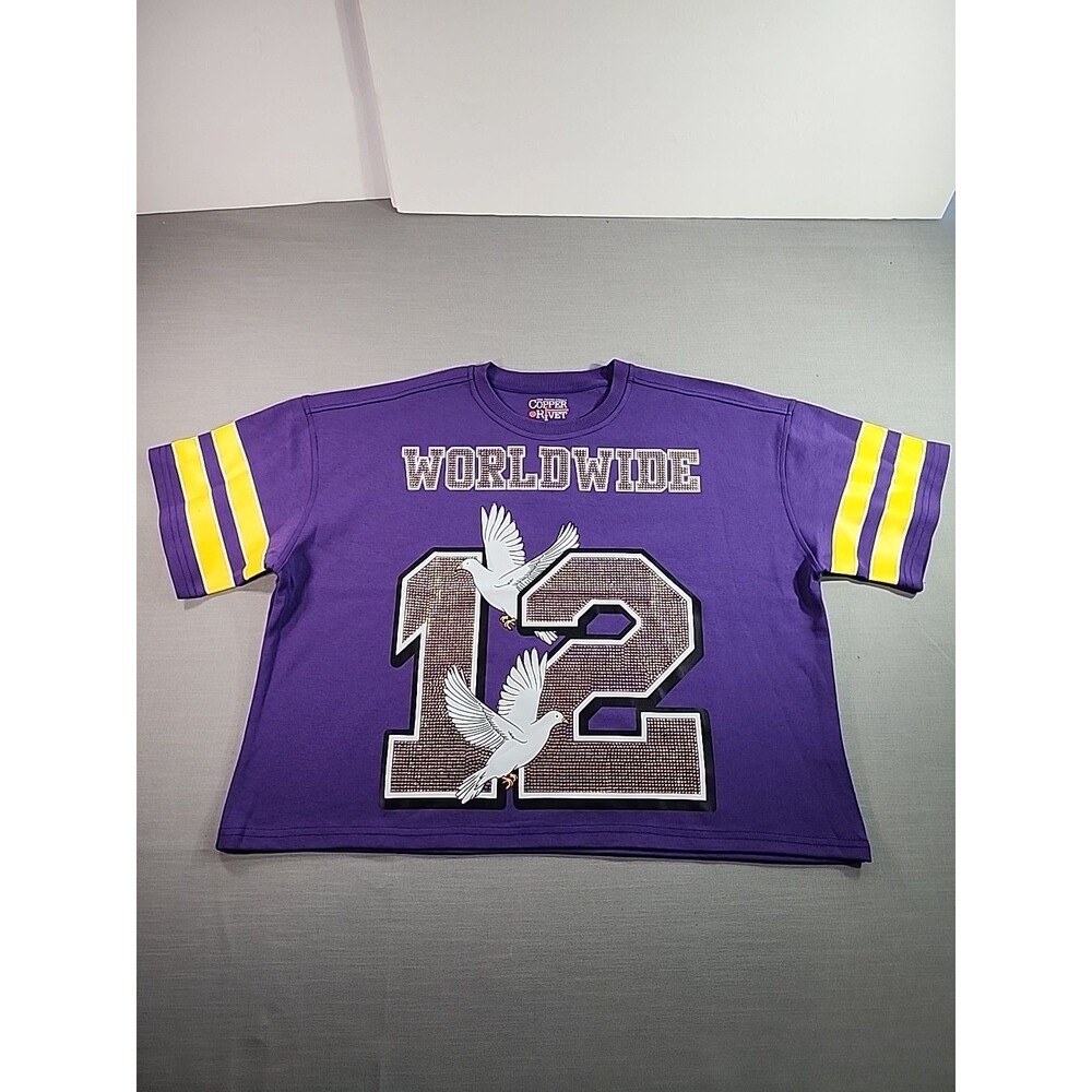 New purple Copper Rivet jersey shirt with "WORLDWIDE 12" and dove graphics.